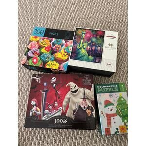 Set of four puzzles featuring vibrant themes including cupcakes, Lady Liberty, a